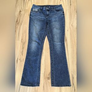 Women's modern fit size 12 blue jeans with decorative pockets